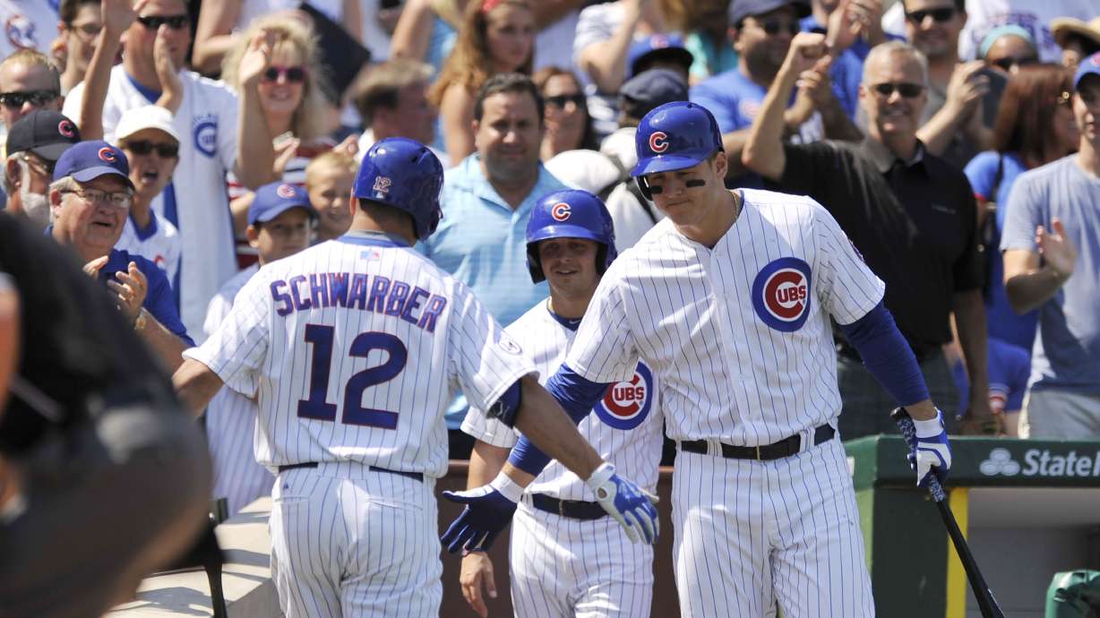 Bryant 2 HRs, fan hurt as Cubs hand Braves 7th straight loss