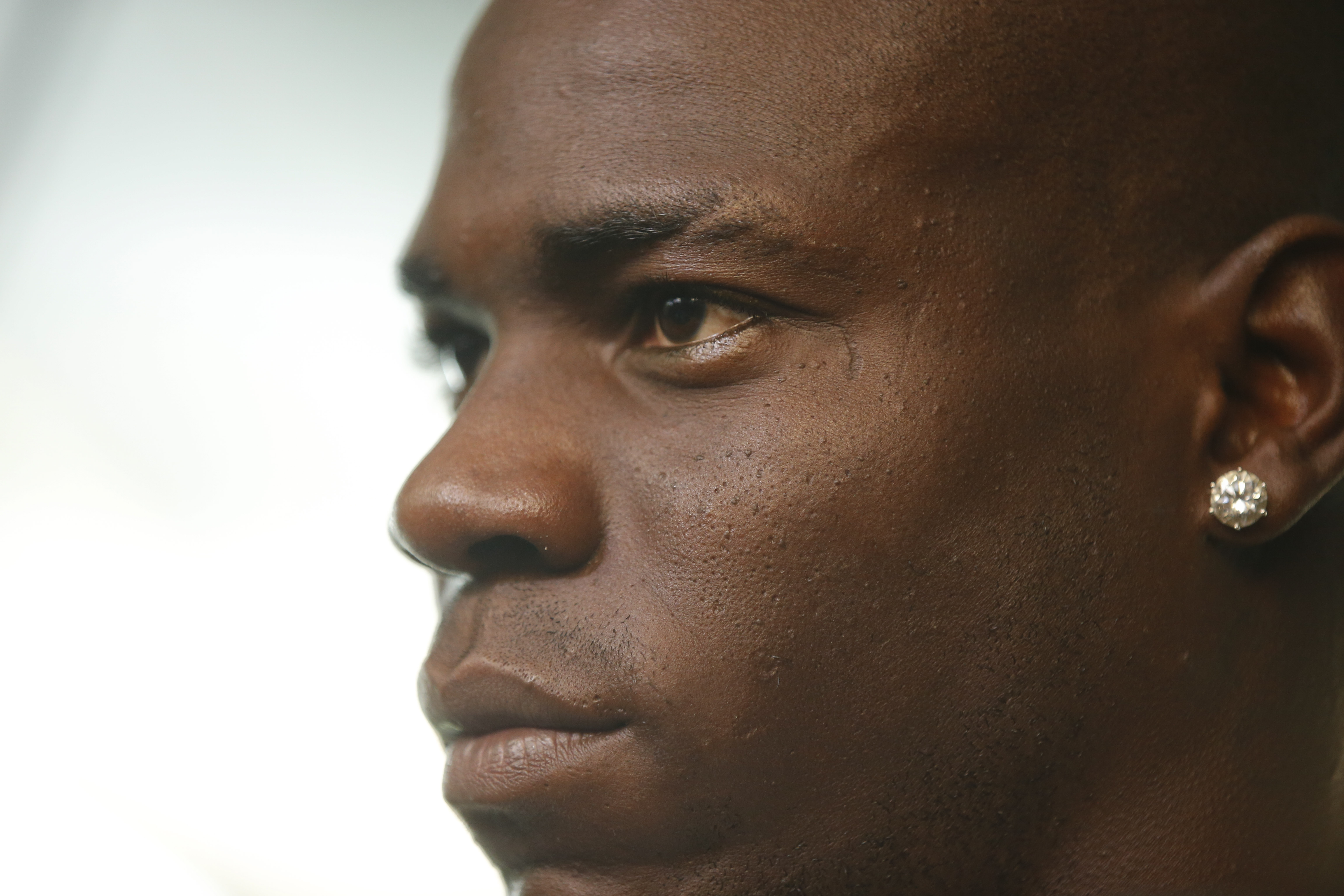 Returning to Milan, Balotelli vows to 'work hard, talk less'
