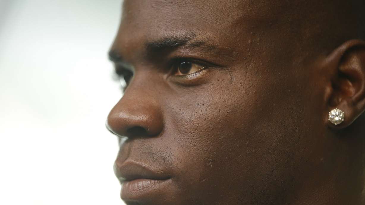 Returning to Milan, Balotelli vows to 'work hard, talk less'