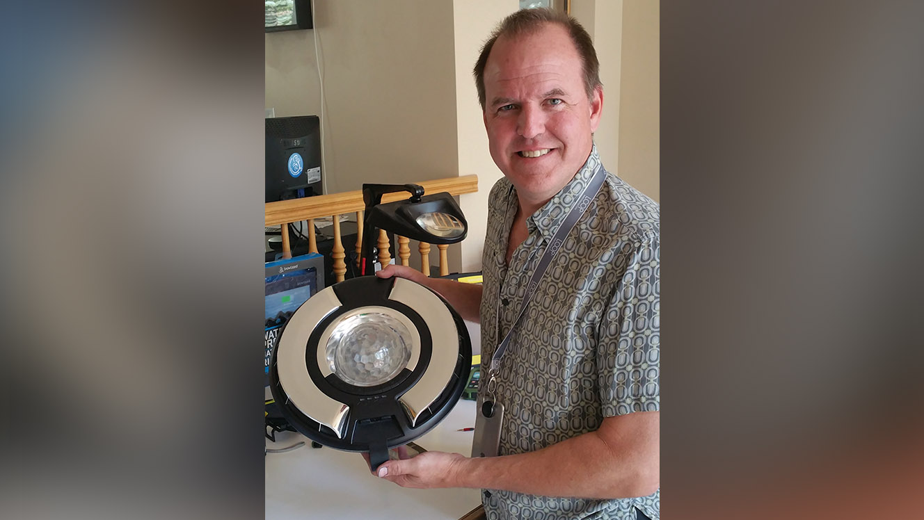 Andy Haase wearing the Loop Plus and holding the OMO. (Photo: Mike Stapely)