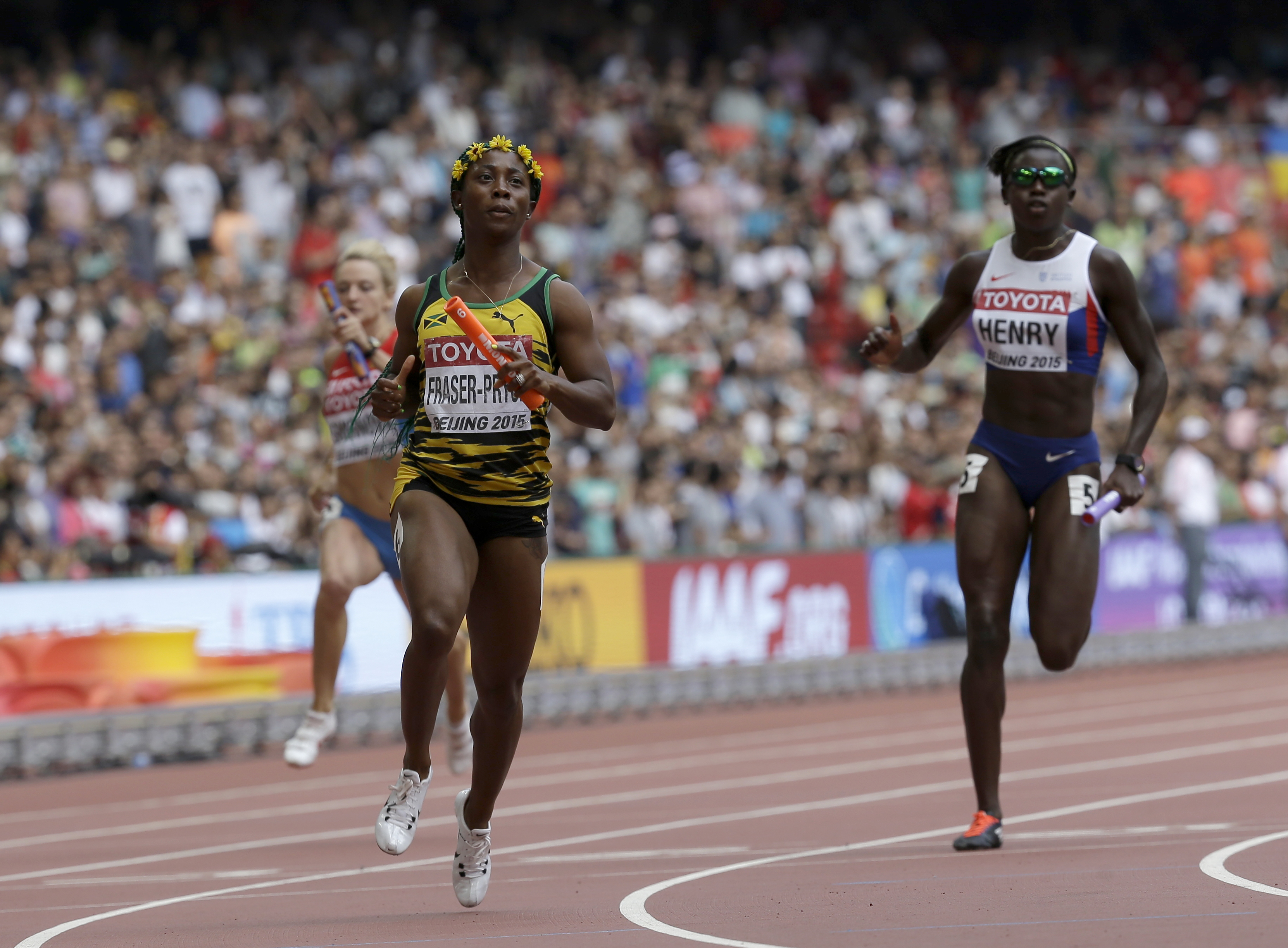 The Latest: US disqualified from men's 4x100 relay at worlds