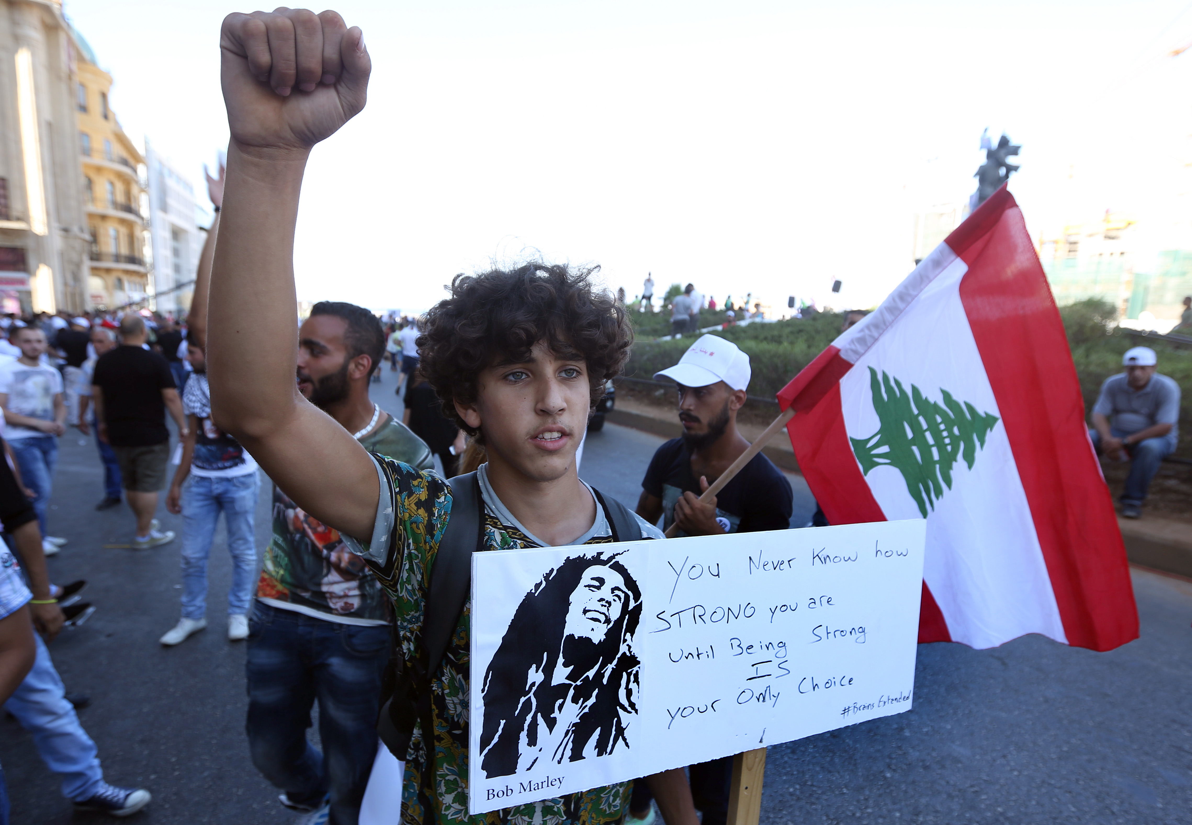 The Latest: Lebanese group threaten to escalate protests