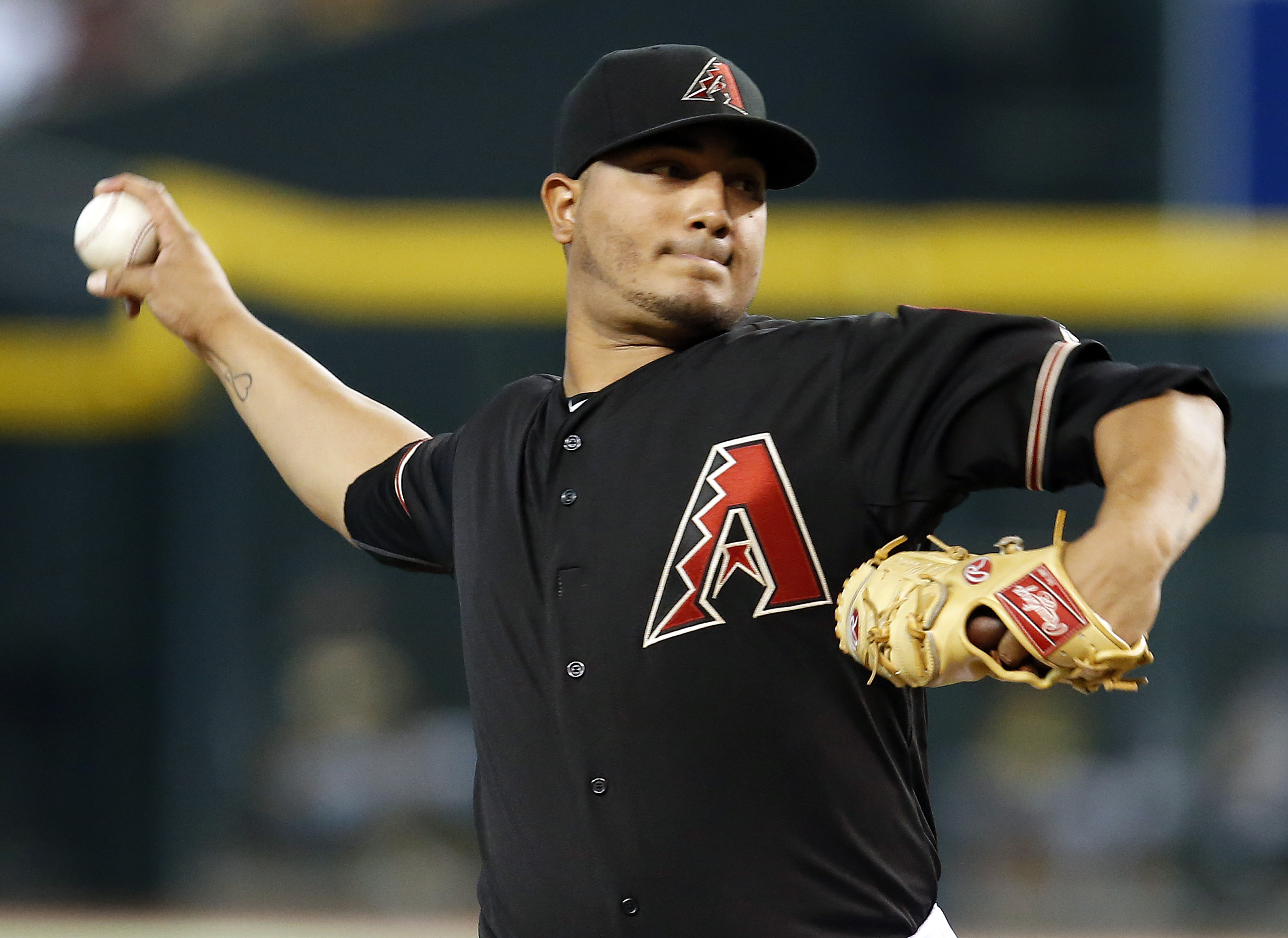 Vogt atones for mistakes, leads A's past Arizona 3-2