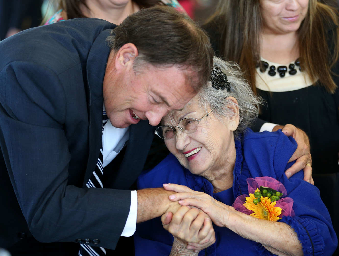 Gov. Gary Herbert hugs Telesila Castro at the 29th Centenarian Celebration at the Viridian Event Center in West Jordan on Friday, Aug. 28, 2015. (Photo: Kristin Murphy, Deseret News)