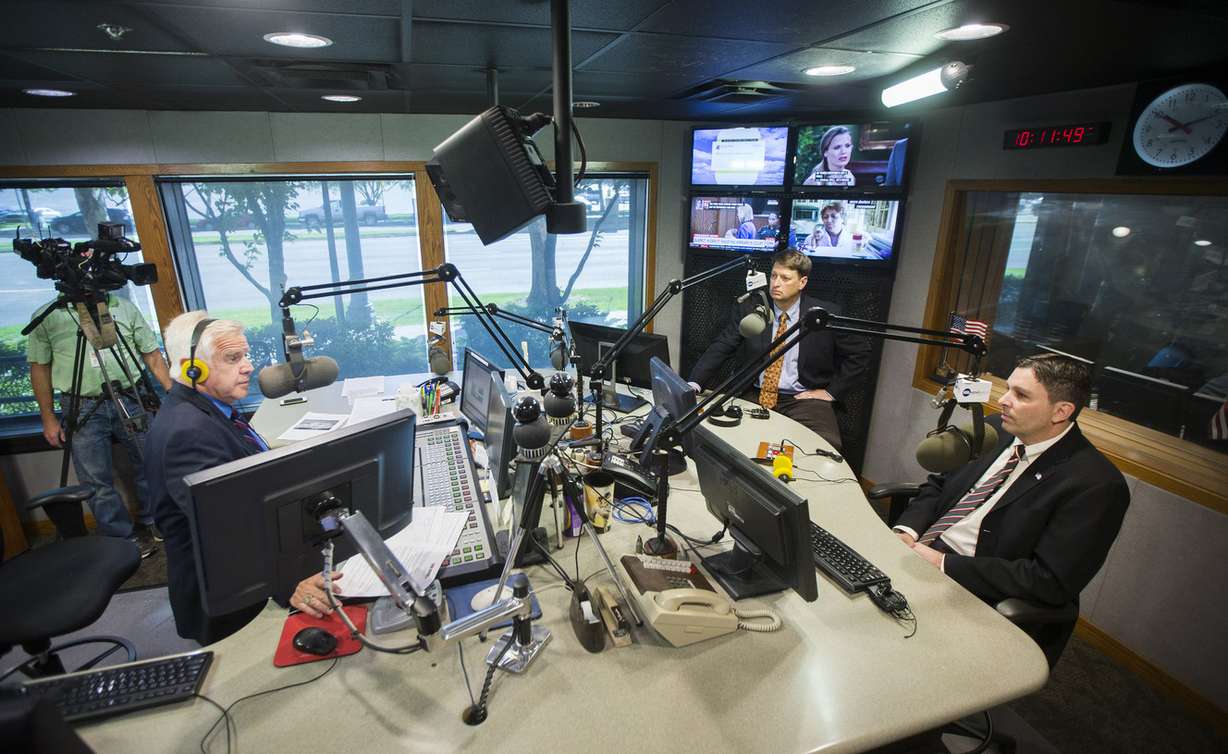Dugway Program Manager Damon Nicholson, center back, and Shannon Fox, Department of Homeland Security Jack Rabbit II program manager and scientist, talk Monday, Aug. 31, 2015, with KSL's Doug Wright on his radio show in Salt Lake City. (Photo: Scott G Winterton, Deseret News)