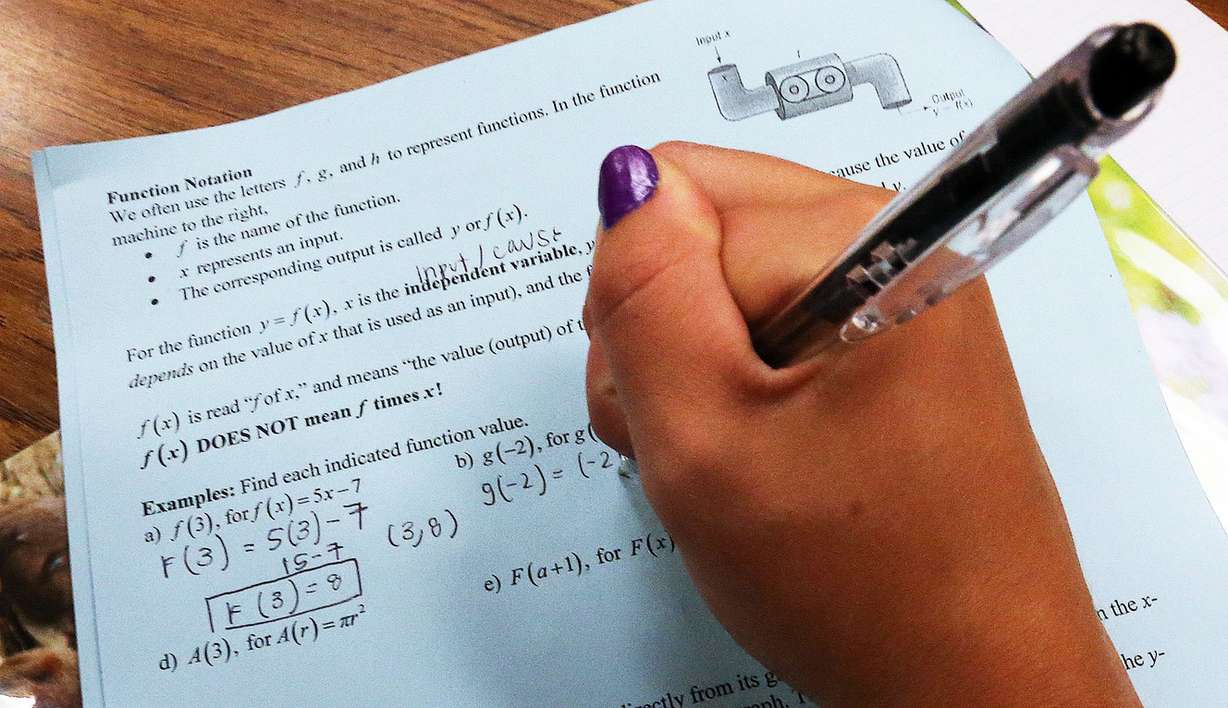 A student writes down answers as Noelani Ioane teaches a college preparation math class at Bingham High School in South Jordan, Monday, Aug. 31, 2015. (Photo: Ravell Call, Deseret News)