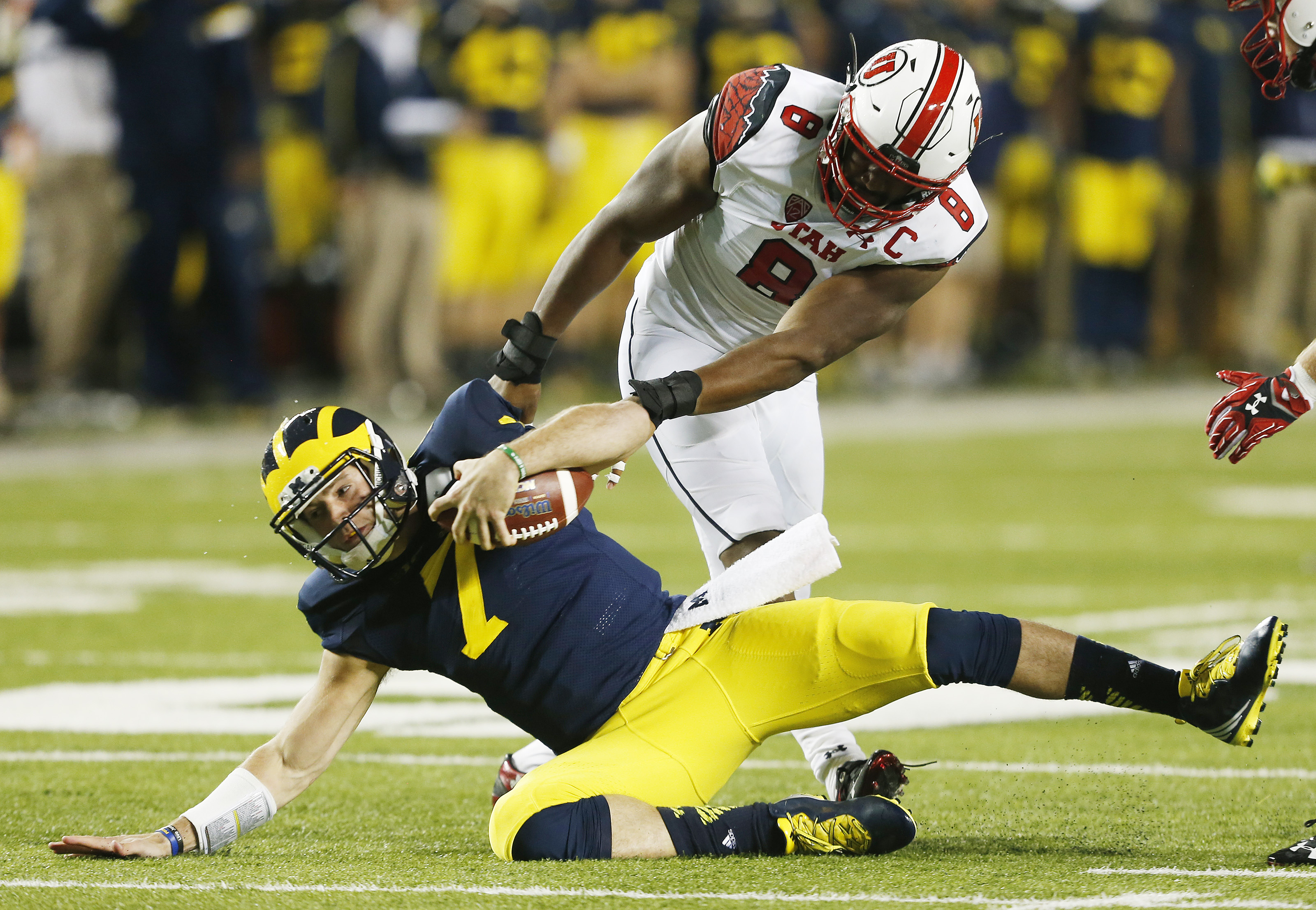 Utah Utes defensive end Nate Orchard (8) sacks Michigan Wolverines quarterback Shane Morris (7) in Ann Arbor, Michigan Saturday, Sept. 20, 2014. Utah beat Michigan 26-10 after a 2 hour, 24-minute lightning delay. (Photo: Jeffrey D. Allred/Deseret News)