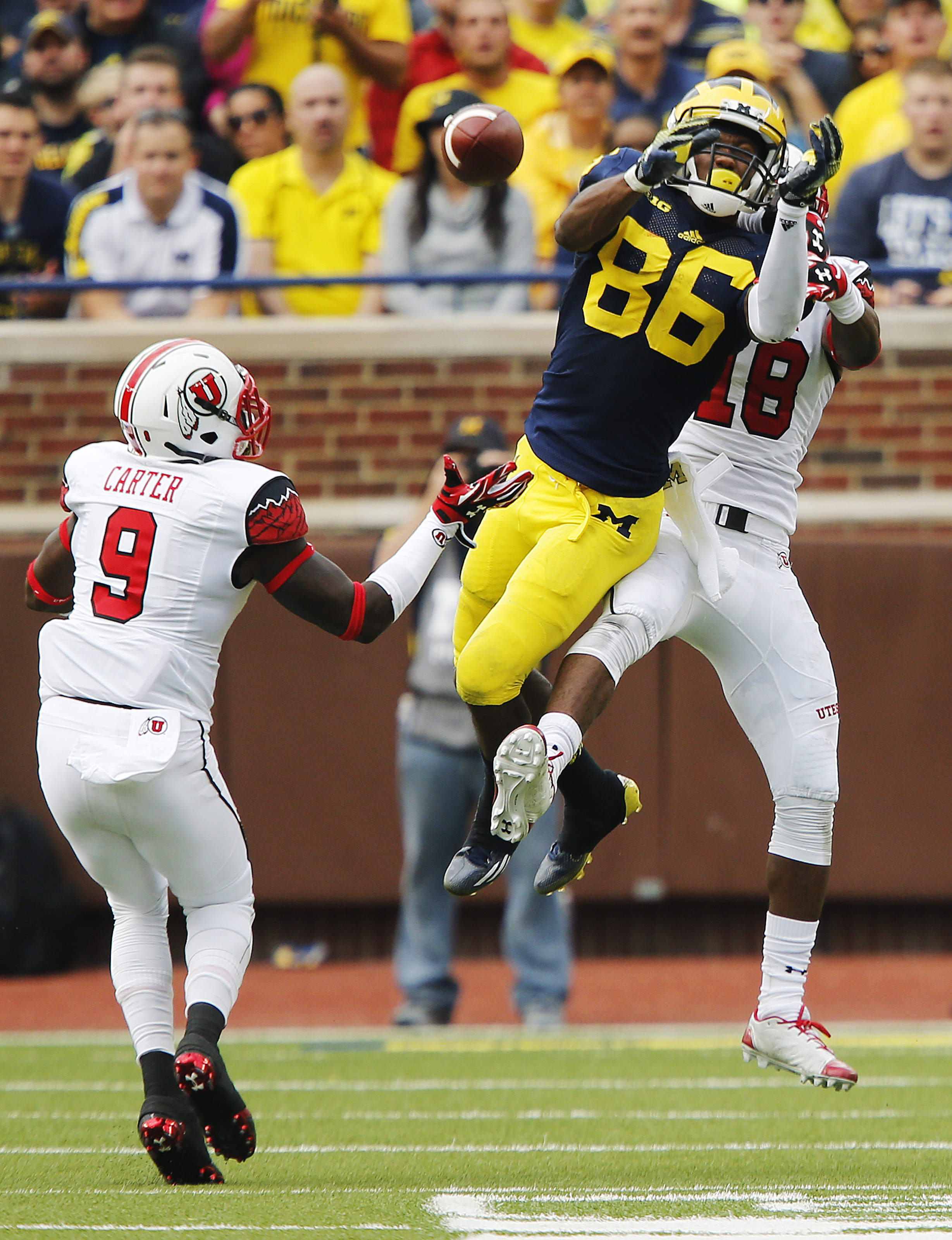 Utah Utes defensive back Eric Rowe (18) and Utah Utes defensive back Tevin Carter (9)* defend Michigan Wolverines wide receiver Jehu Chesson (86) in Ann Arbor, Michigan Saturday, Sept. 20, 2014. Utah lead Michigan 26-10 in the fourth quarter before a lightning delay. (Photo: Jeffrey D. Allred/Deseret News