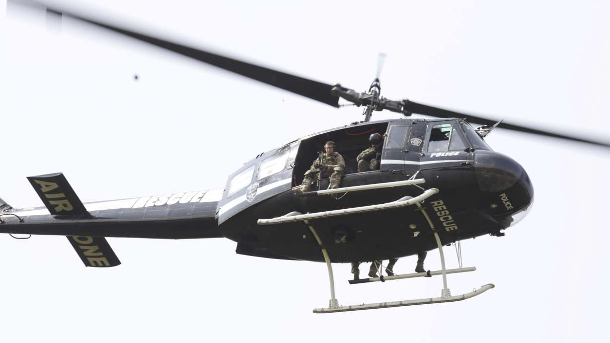 The Latest: Heavy police presence near where officer shot