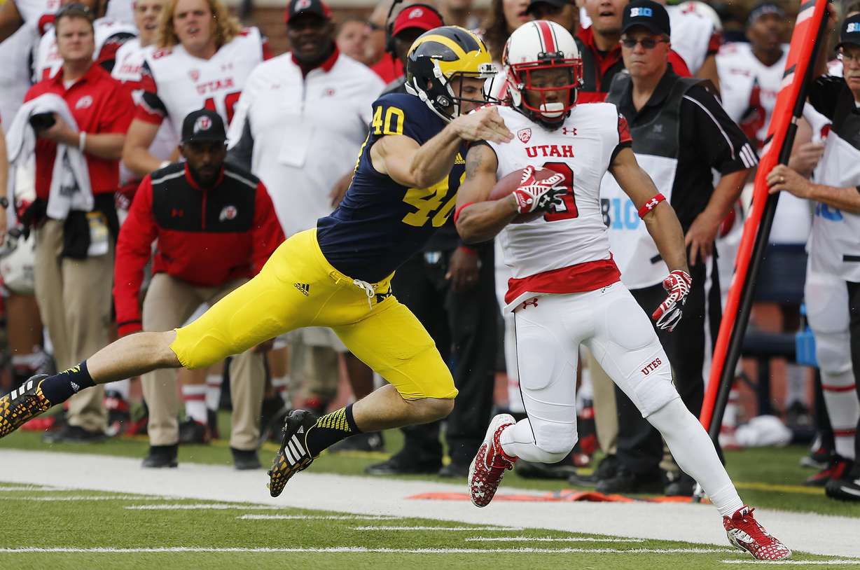 Utah Utes wide receiver Kaelin Clay (8) scores a punt return touchdown against Michigan Wolverines in Ann Arbor, Michigan Saturday, Sept. 20, 2014. (Photo: Jeffrey D. Allred/Deseret News)