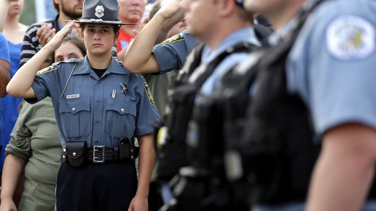 The Latest: Funeral arrangements announced for slain officer