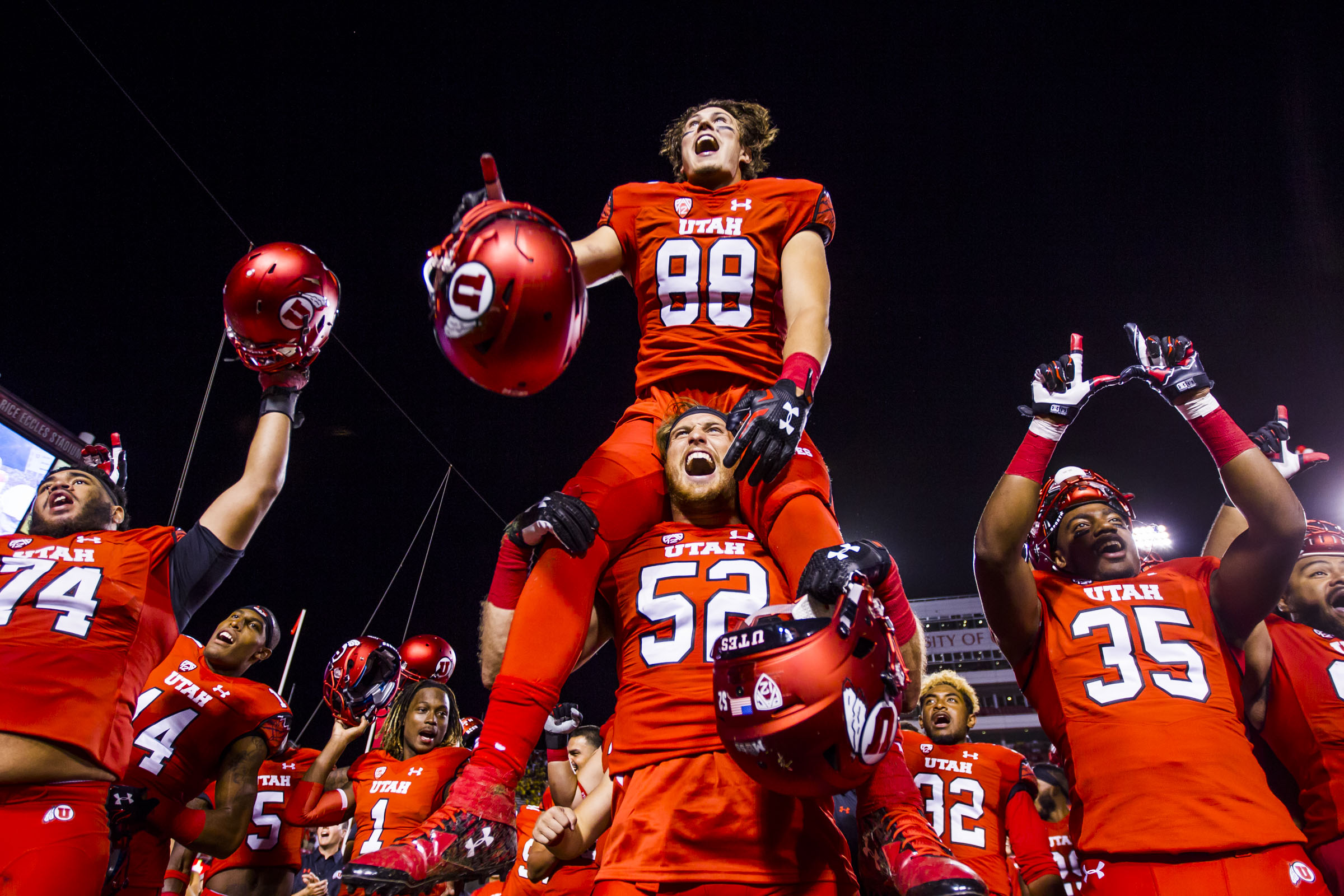 Utah Utes players celebrate their 24-17 win after the Utah Utes and Michigan Wolverines football game at the Rice-Eccles Stadium in Salt Lake City on Thursday, Sept. 3, 2015. (Photo: Stacie Scott/Deseret News)