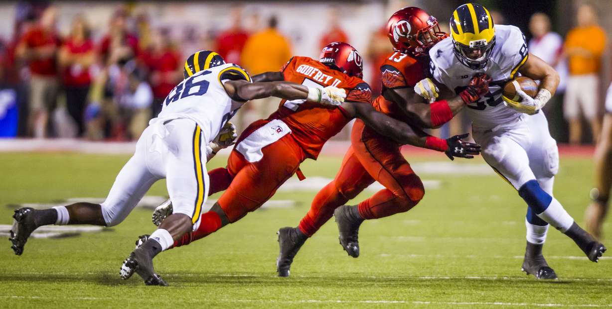 Utah Utes linebacker Gionni Paul (13) tackles Michigan Wolverines tight end Jake Butt (88) during the Utah Utes and Michigan Wolverines football game at the Rice-Eccles Stadium in Salt Lake City on Thursday, Sept. 3, 2015. (Photo: Stacie Scott/Deseret News)