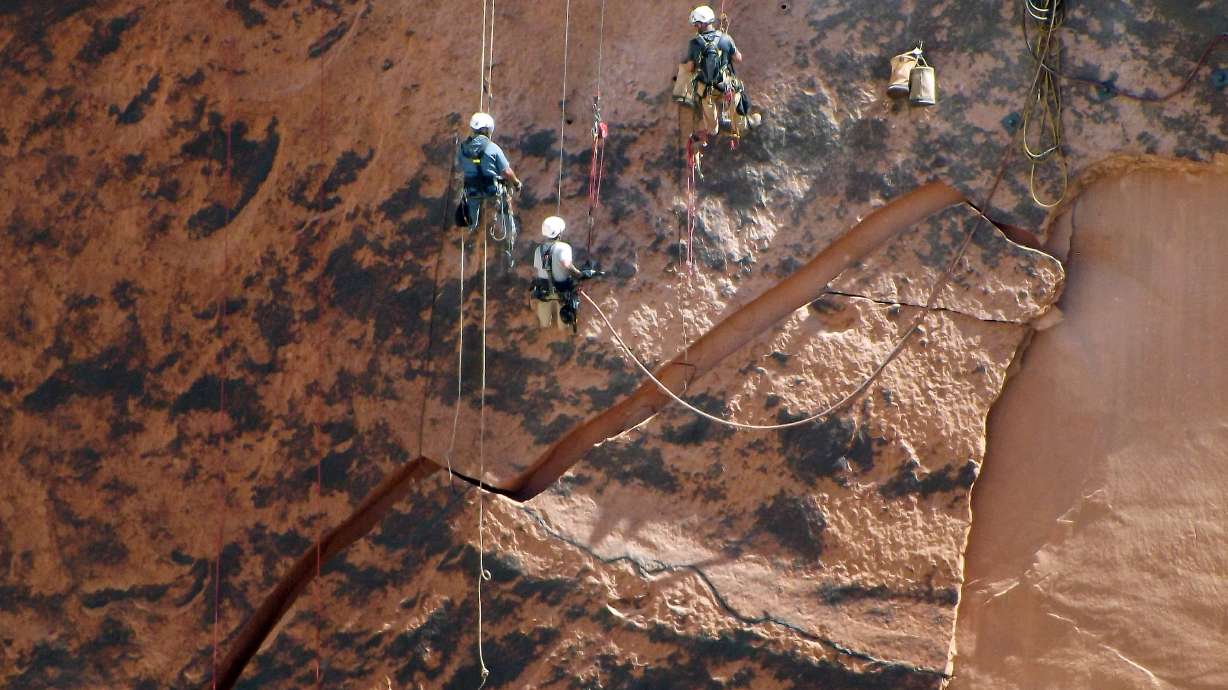Massive rock threatening to crash into base of Glen Canyon Dam