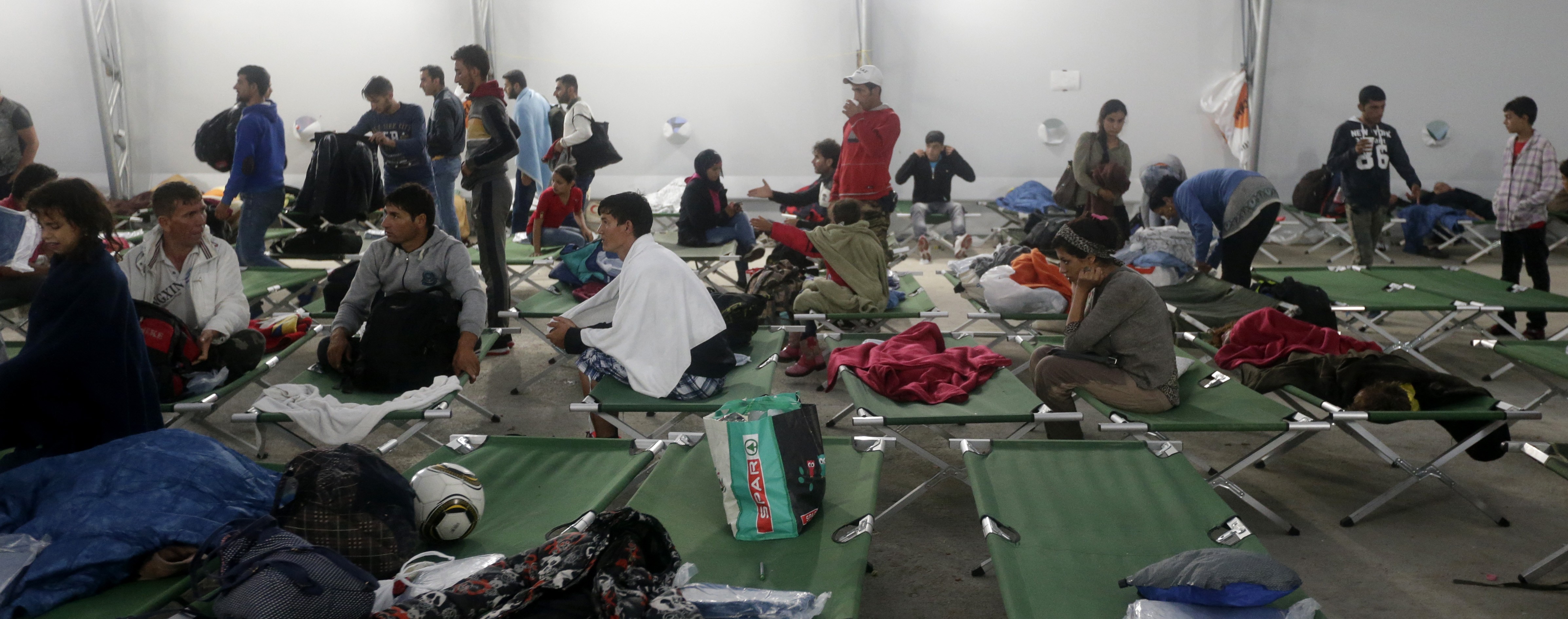 Candy and cuddly toys: Migrants finish epic trek to Germany