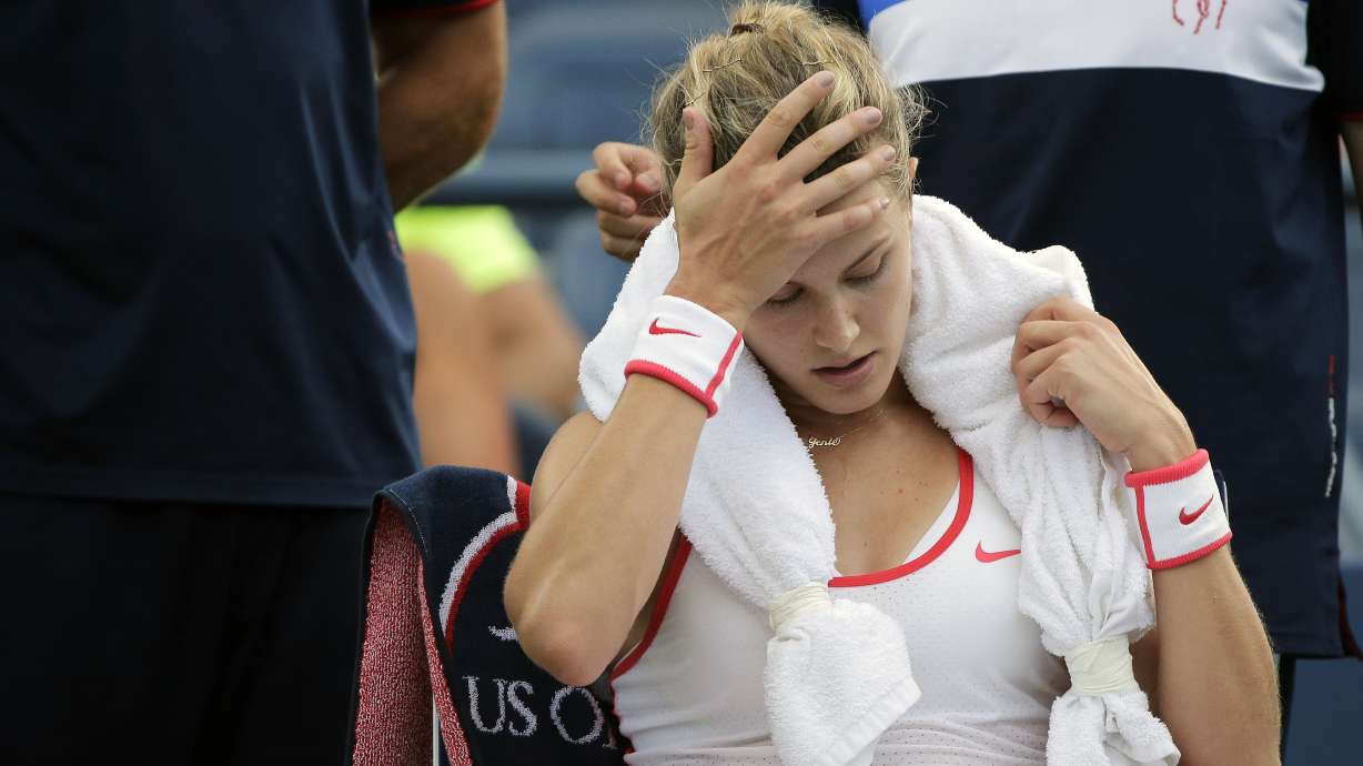 Bouchard hurts head in locker-room fall; out of Open doubles