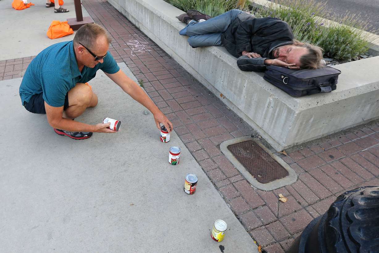 Paul Rys, KeyImpact region chain specialist, helps create a mile-long line of food stretching from Washington Square, in front of the City-County building, to the state Capitol for the Utah Food Bank's Beating Hunger by a Mile campaign in Salt Lake City on Thursday, Sept. 3, 2015. September is national Hunger Action Month. (Photo: Kristin Murphy, Deseret News)