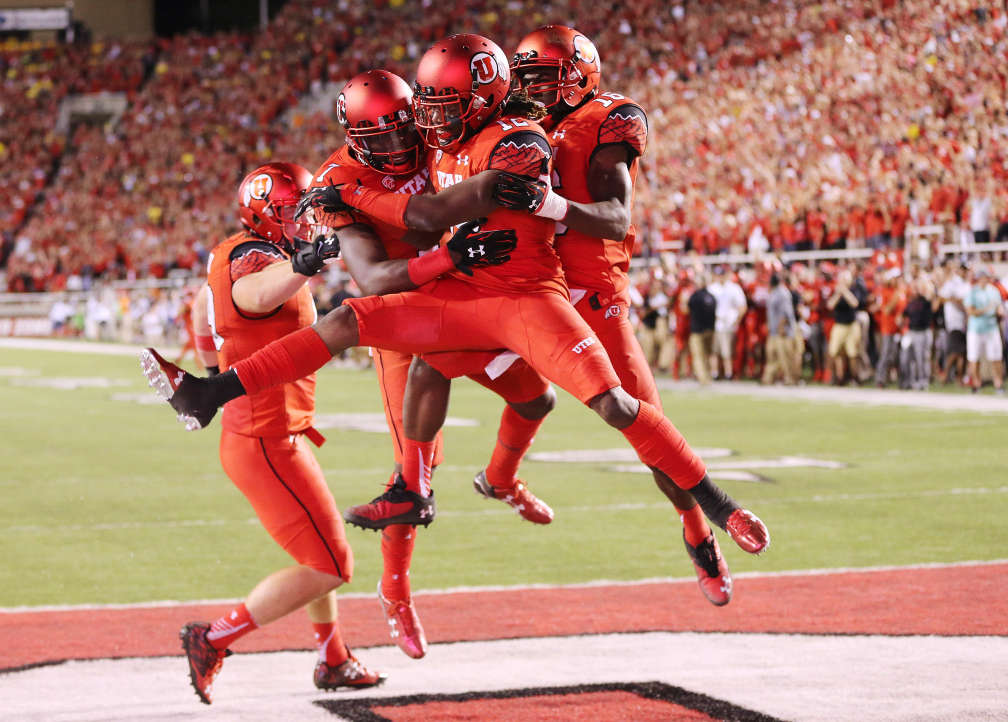 Utah Utes defensive back Justin Thomas (12) celebrates with teammates after interception and touchdown against Michigan in Salt Lake City Thursday, Sept. 3, 2015. Utah won 24-17. (Photo: Jeffrey D. Allred/Deseret News)