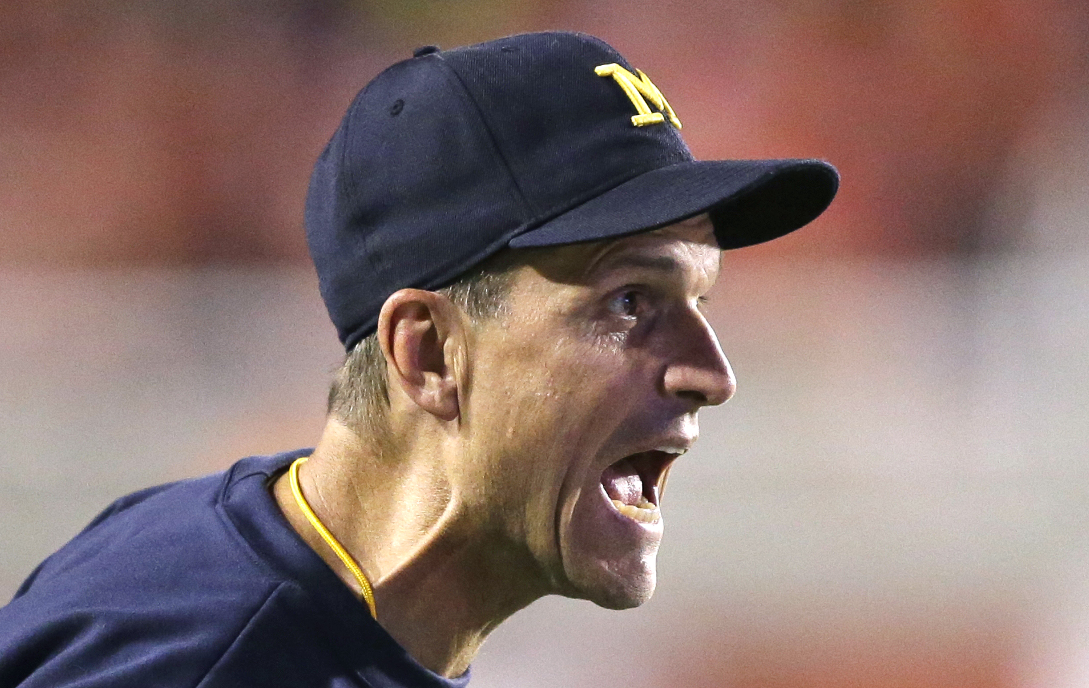 Harbaugh, Michigan regroup after opening loss