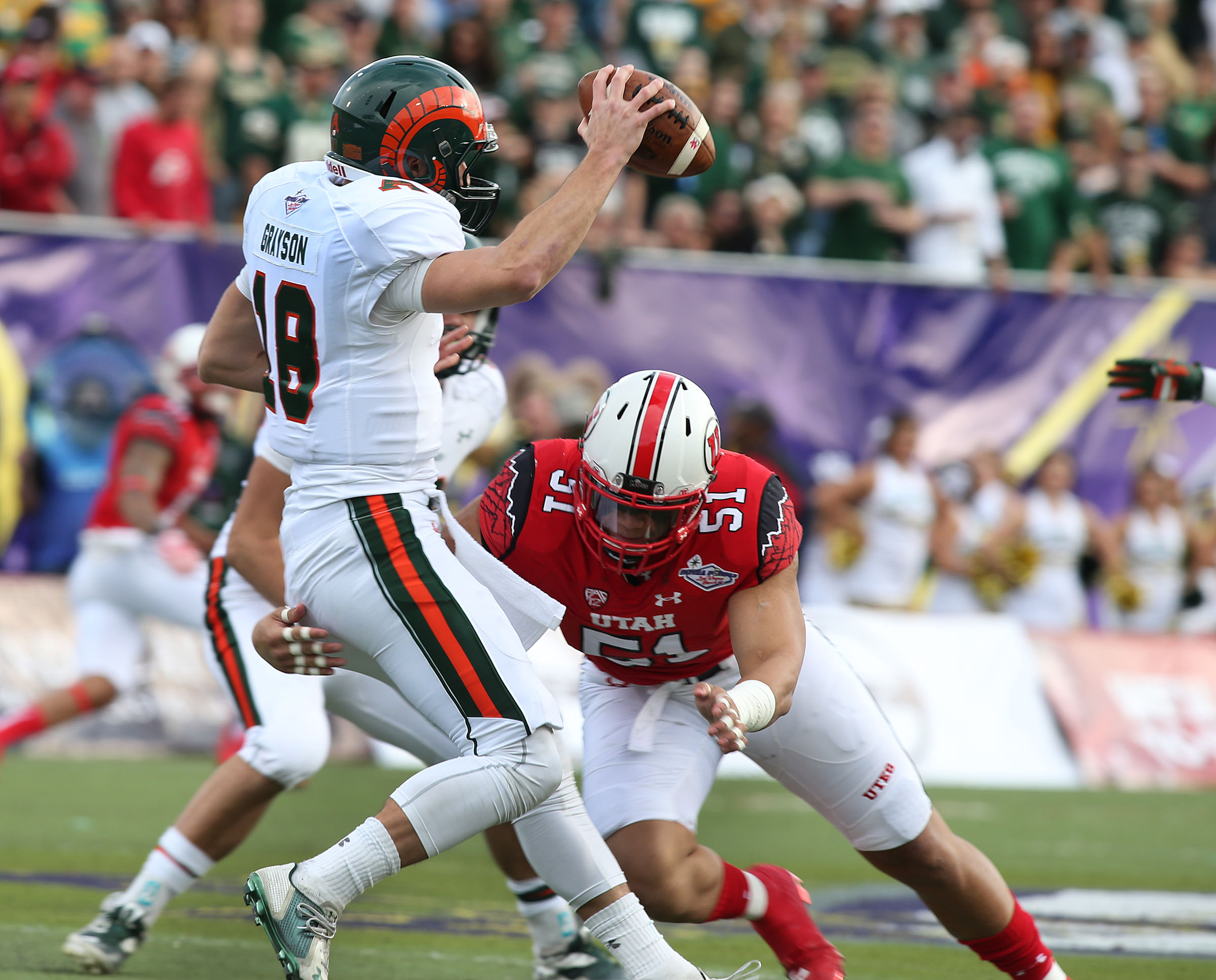 Colorado State Rams quarterback Garrett Grayson (18) is sacked by Utah Utes defensive end Jason Fanaika (51) as the University of Utah plays Colorado State in NCAA football at the Royal Purple Las Vegas Bow. Saturday, Dec. 20, 2014, in Las Vegas. (Photo: Tom Smart/Deseret News)