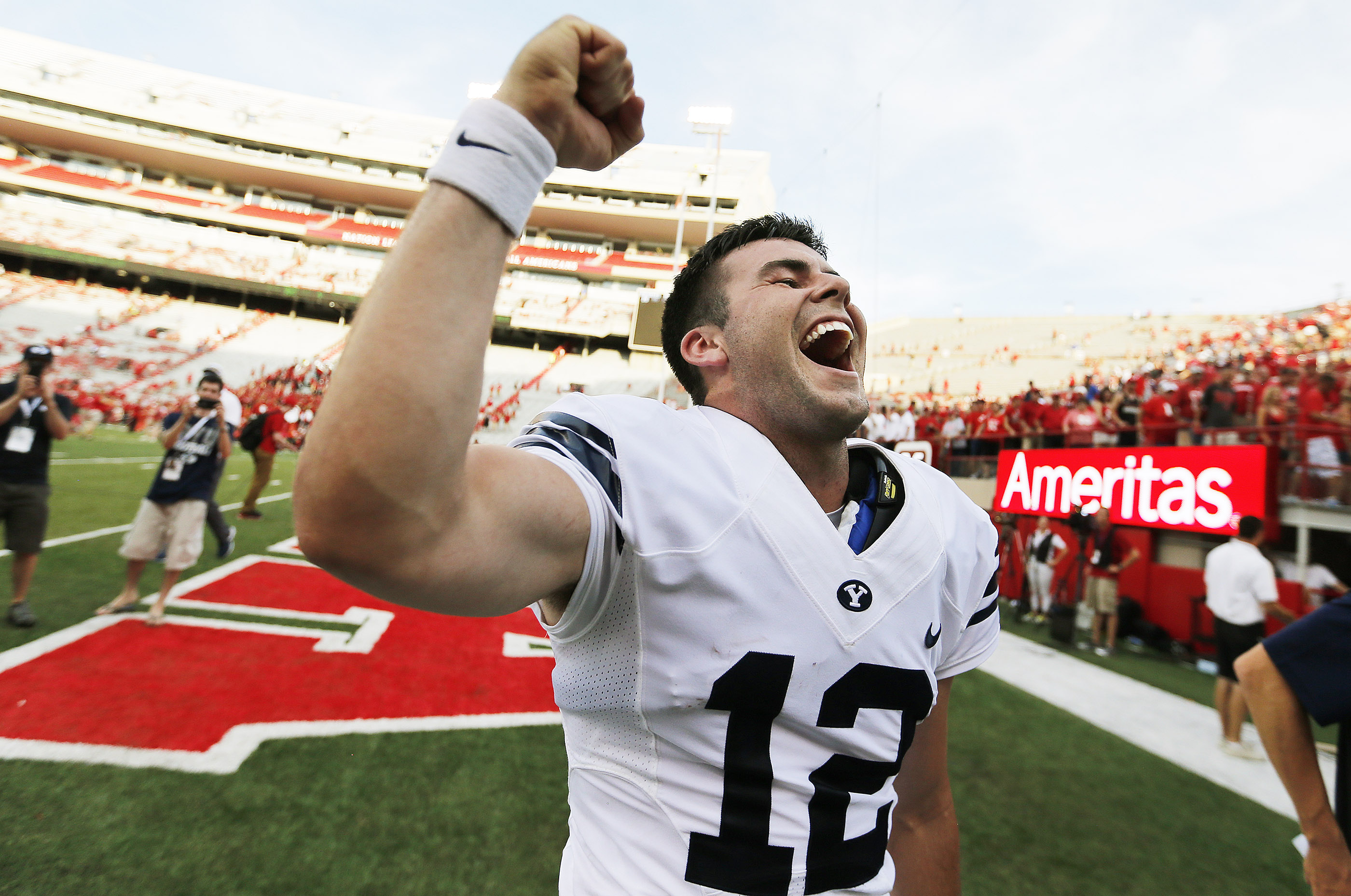 Brigham Young Cougars quarterback Tanner Magnum (12) celebrates after throwing the winning touchdown against Nebraska in Lincoln, NE Saturday, Sept. 5, 2015. BYU won 33-28. (Photo: Jeffrey D. Allred)