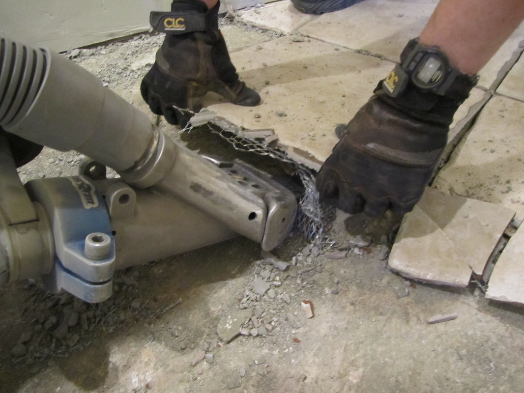 Patented technology that helps remove dust while removing the tile. Photo credit: Tile Ram