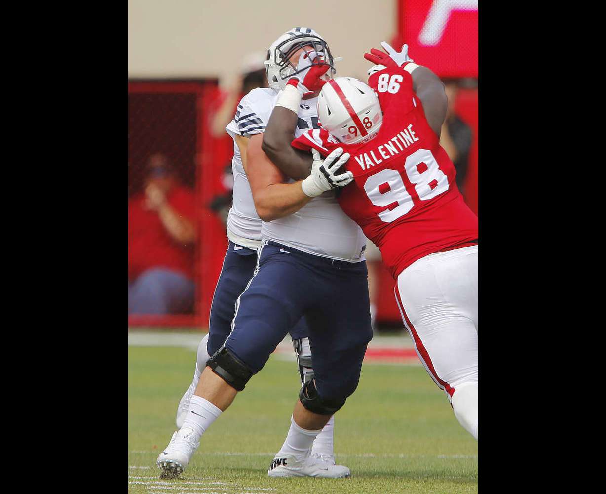 BYU offensive lineman Kyle Johnson (67) gets a hand in the face by Nebraska defensive tackle Vincent Valentine (98) in Lincoln, Nebraska on Sept. 5, 2015. BYU won 33-28 on a last second touchdown pass. (Jeffrey D. Allred/Deseret News)