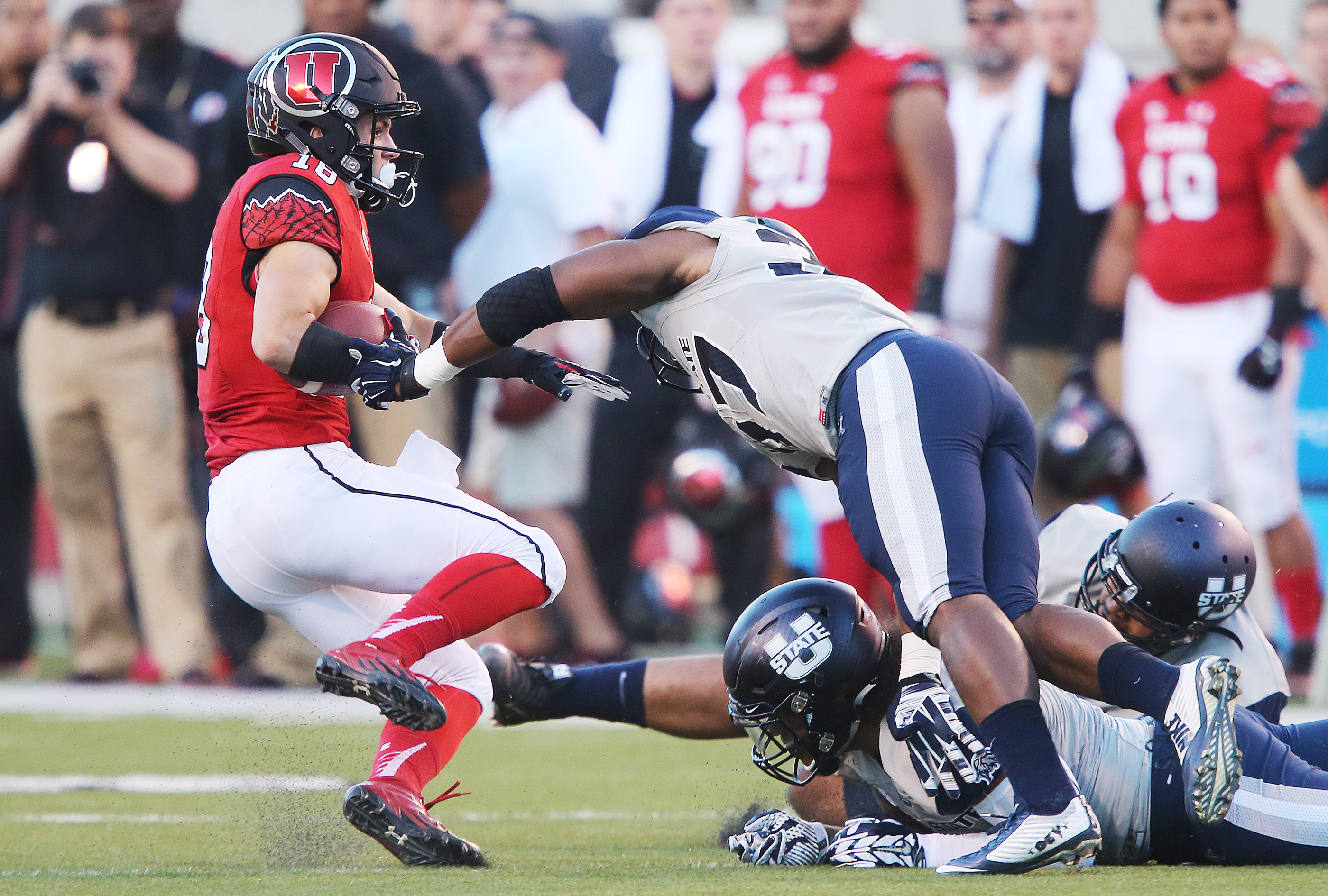 Utah Utes wide receiver Britain Covey (18) gets away from several Utah State Aggies in Salt Lake City Friday, Sept. 11, 2015. Utah won 24-14. (Photo: Jeffrey D. Allred/Deseret News)