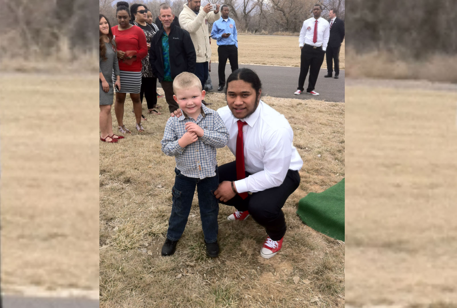 Roy running back Baby Tee Eteuati poses for a photo with 5-year-old Roy fan Cannon Wardleigh after the young fan came to support Eteuati at his brother's funeral. (Courtesy photo: Charity Wardleigh)