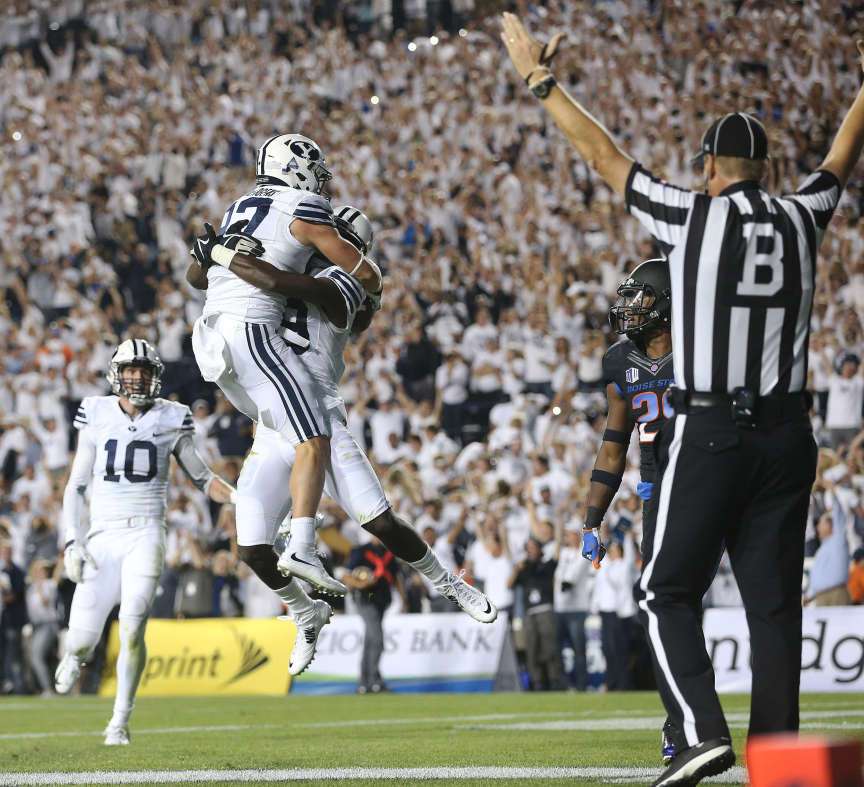 Mitchell Juergens (87) celebrates with teammates after catching the go ahead touchdown as BYU and Boise State play Saturday, Sept. 12, 2015, at LaVell Edwards Stadium in Provo. BYU won 35-24. (Photo: Scott G Winterton, Deseret News)