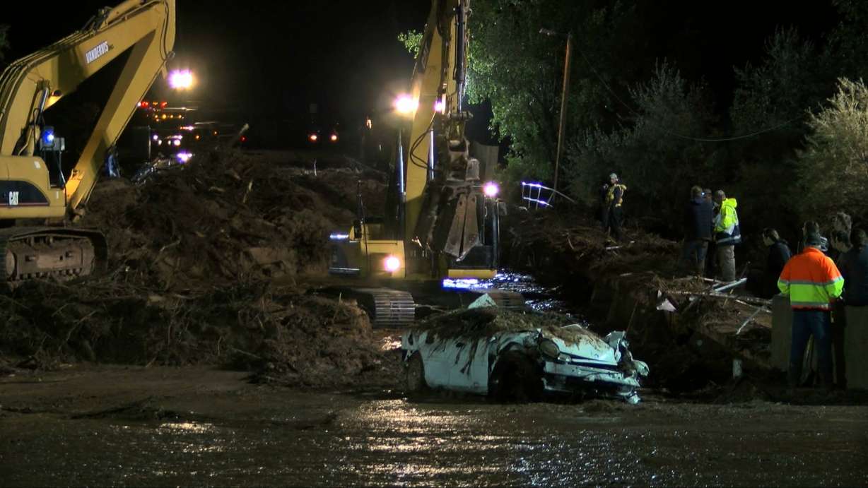 A white car was swept away in the flash flood that killed at least eight people. (Photo: Stace Hall/KSL-TV)