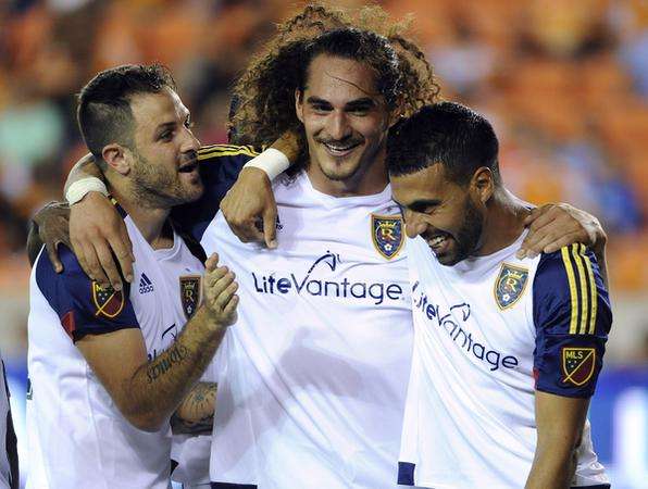 Real Salt Lake's Juan Manuel Martinez, Devon Sandoval andJavier Morales celebrate a 3-1 win over Houston Dynamo. (AP Photo/Eric Christian)