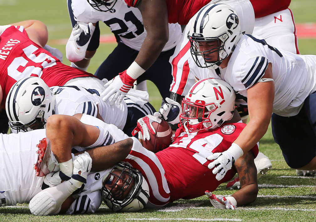 BYU defensive linemen Bronson Kaufusi (90) and Logan Taele (62) tackle Nebraska Cornhuskers running back Terrell Newby (34) in Lincoln, NE Sunday, Sept. 6, 2015. BYU won 33-28 on a last second touchdown pass. (Photo: Jeffrey D. Allred/Deseret News)