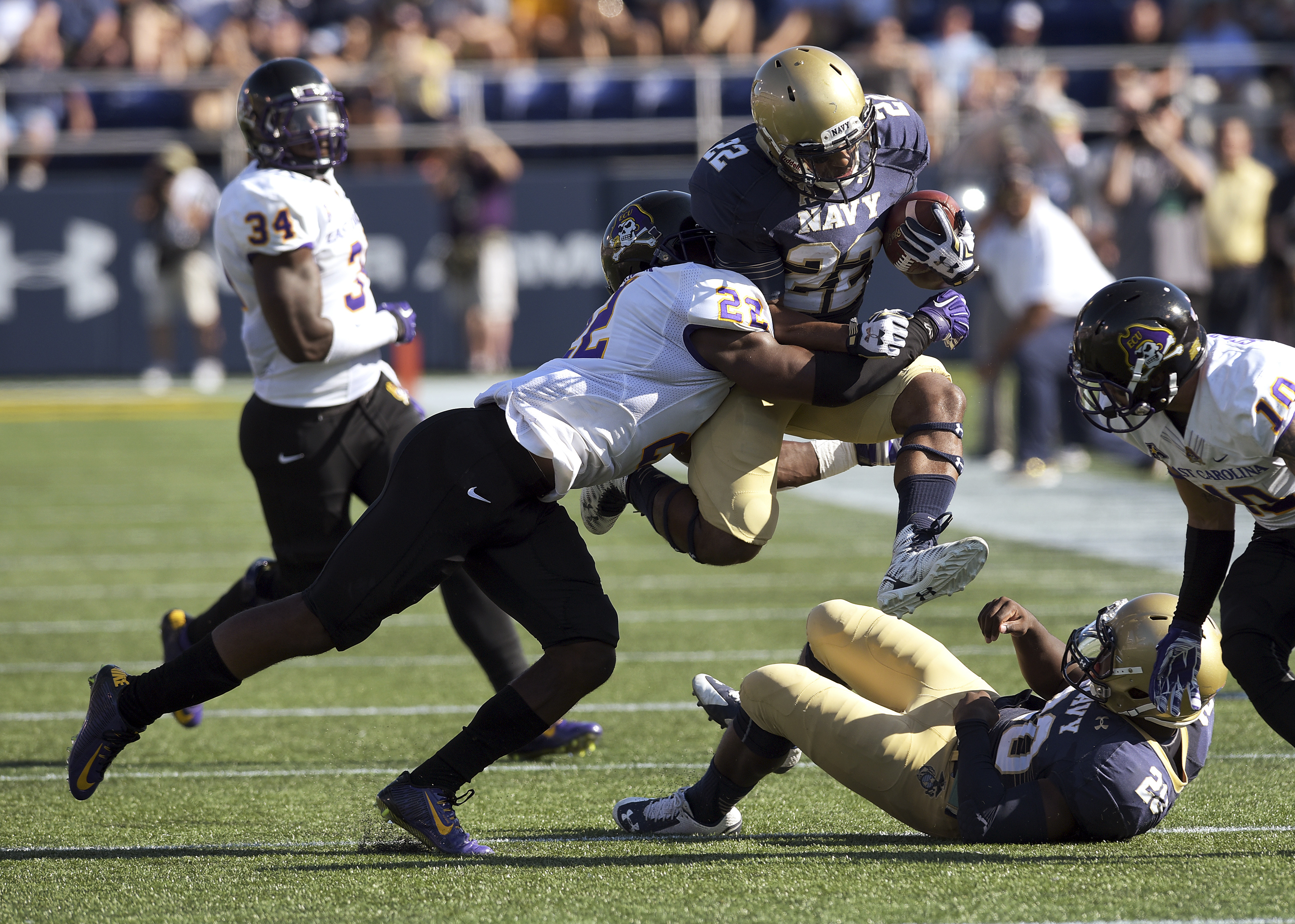 Navy runs through East Carolina 45-21