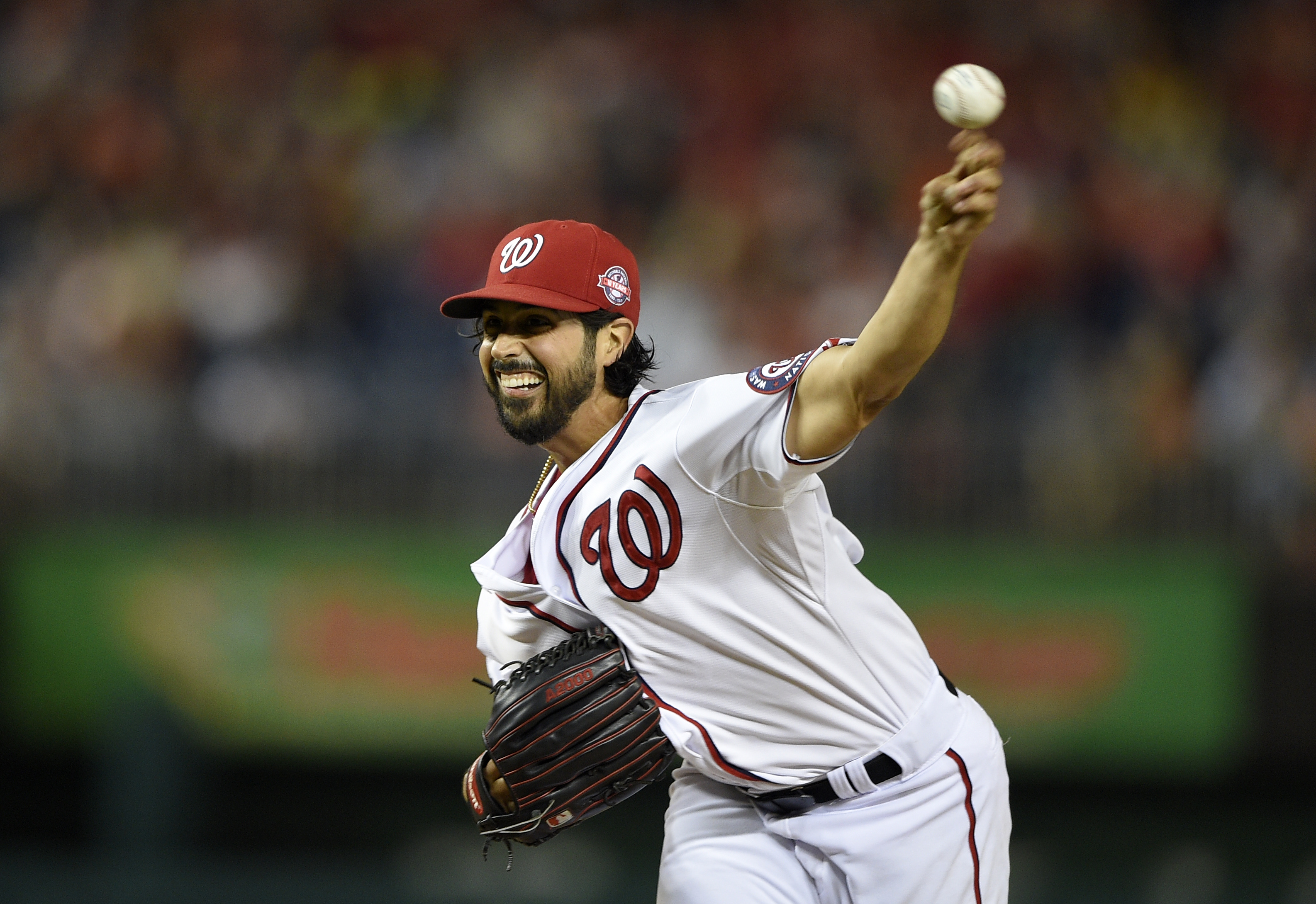 Jimenez gets 100th career victory, Orioles beat Nationals