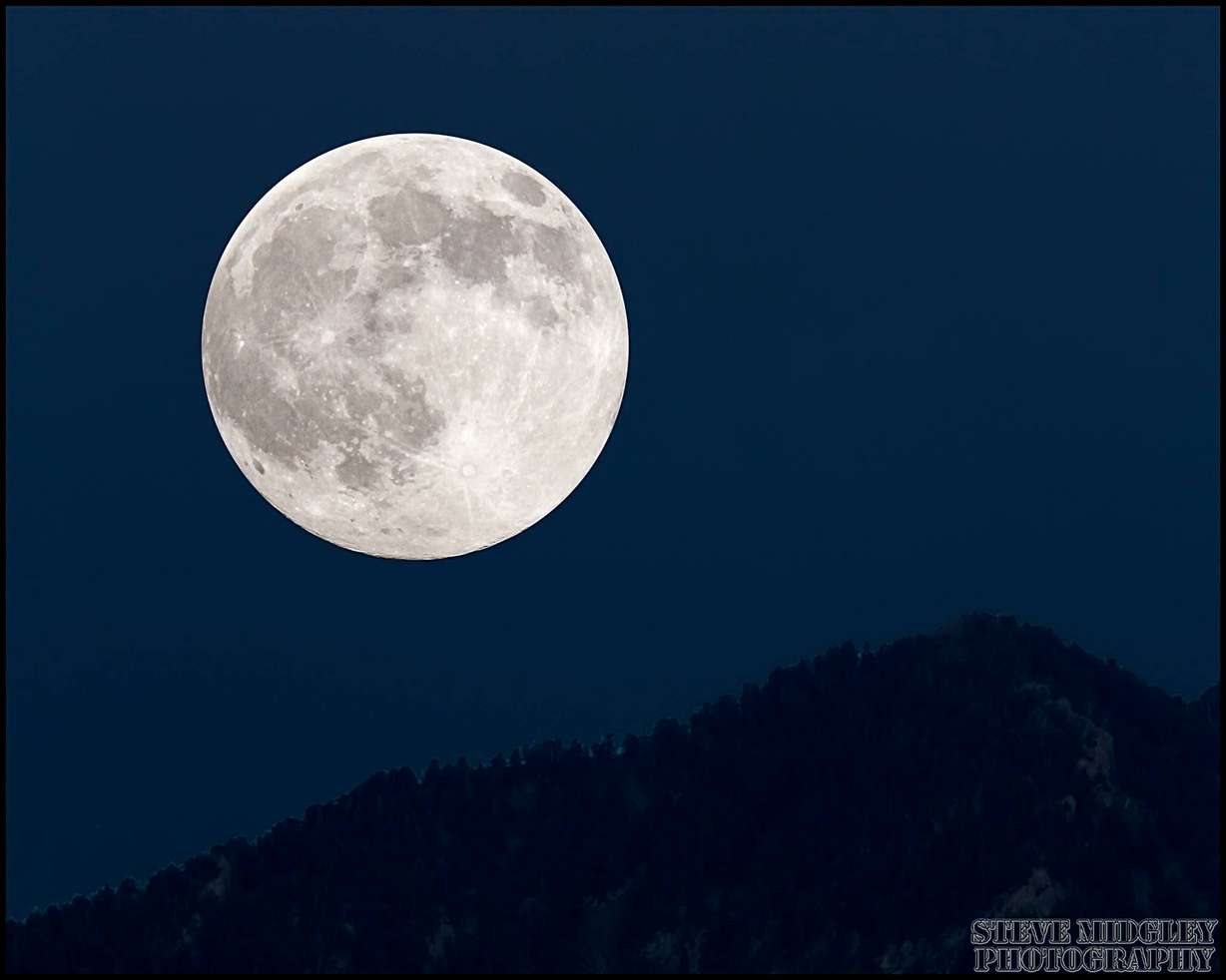 The July 11, 2014 "Super Moon" rises over the Wasatch. Photo taken from Sugar House. (Photo: Steve Midgley, submitted using iWitness)