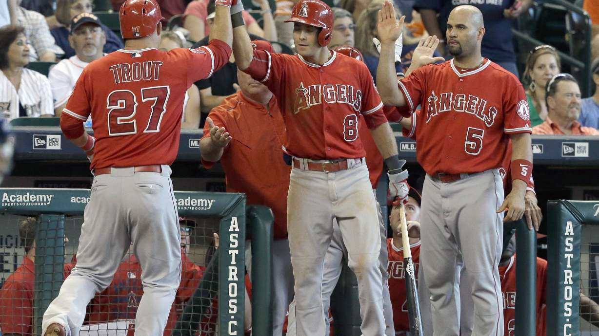 Angels rally for 6-5 win over Astros to close wild-card gap
