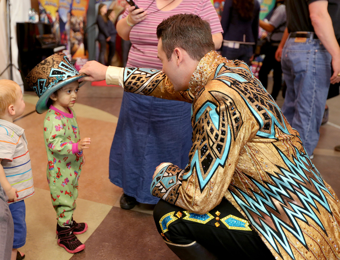 Abigail Carrillo tries on Ringmaster David Shipman's hat as performers from Ringling Bros. and Barnum & Bailey® Presents Circus XTREME entertain patients and their families at Primary Children's Hospital, Thursday, Sept. 24, 2015, in Salt Lake City. 
 (Photo: Tom Smart, Deseret News)