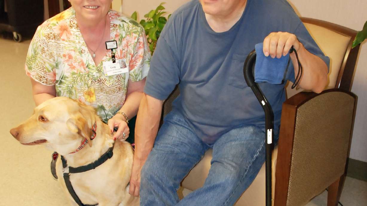 Dog gets massages as Fremont man regains hand coordination