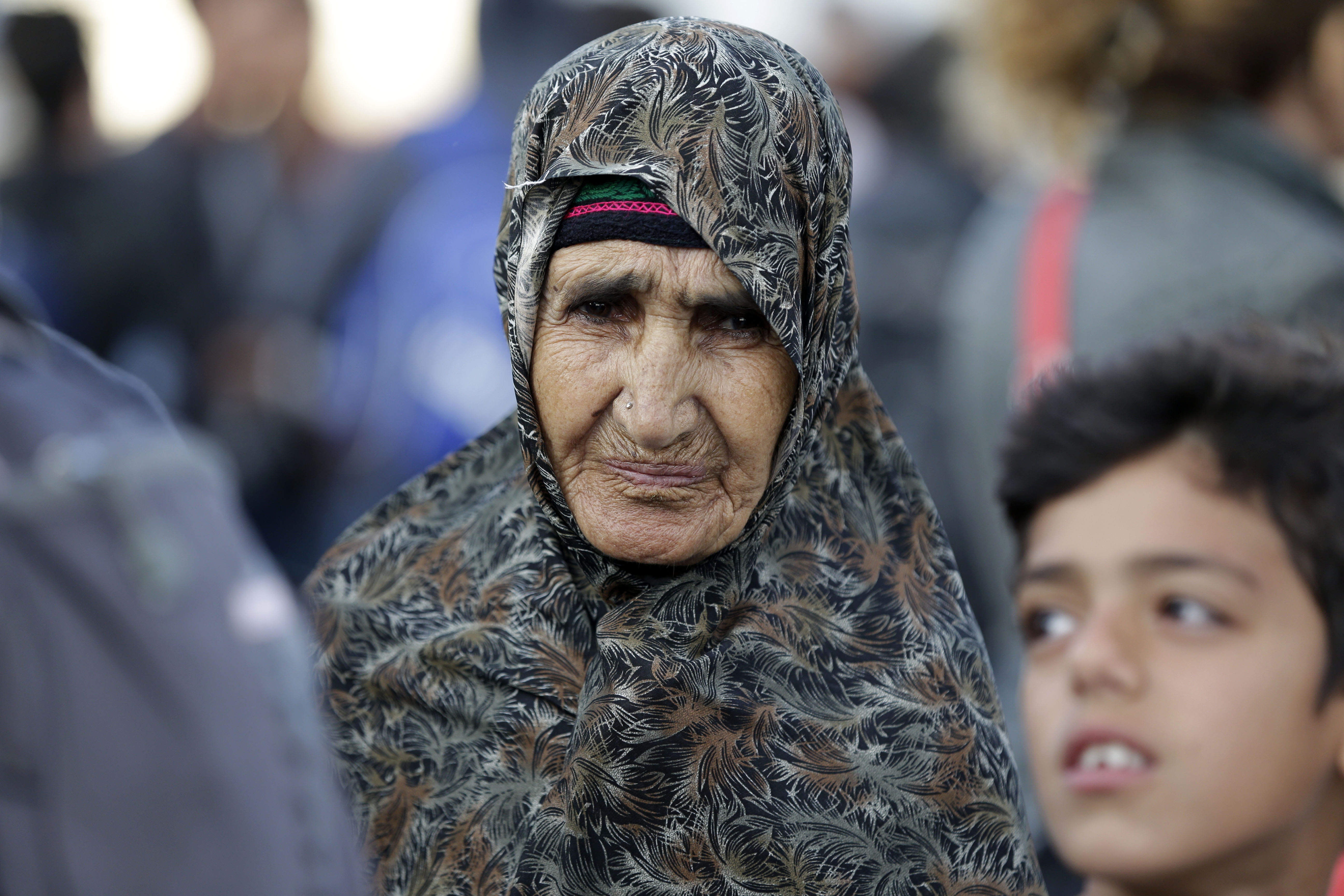 The Latest: Migrants quit rocks on the Italian-French border