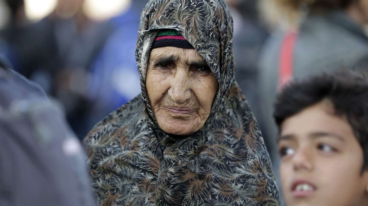 The Latest: Migrants quit rocks on the Italian-French border