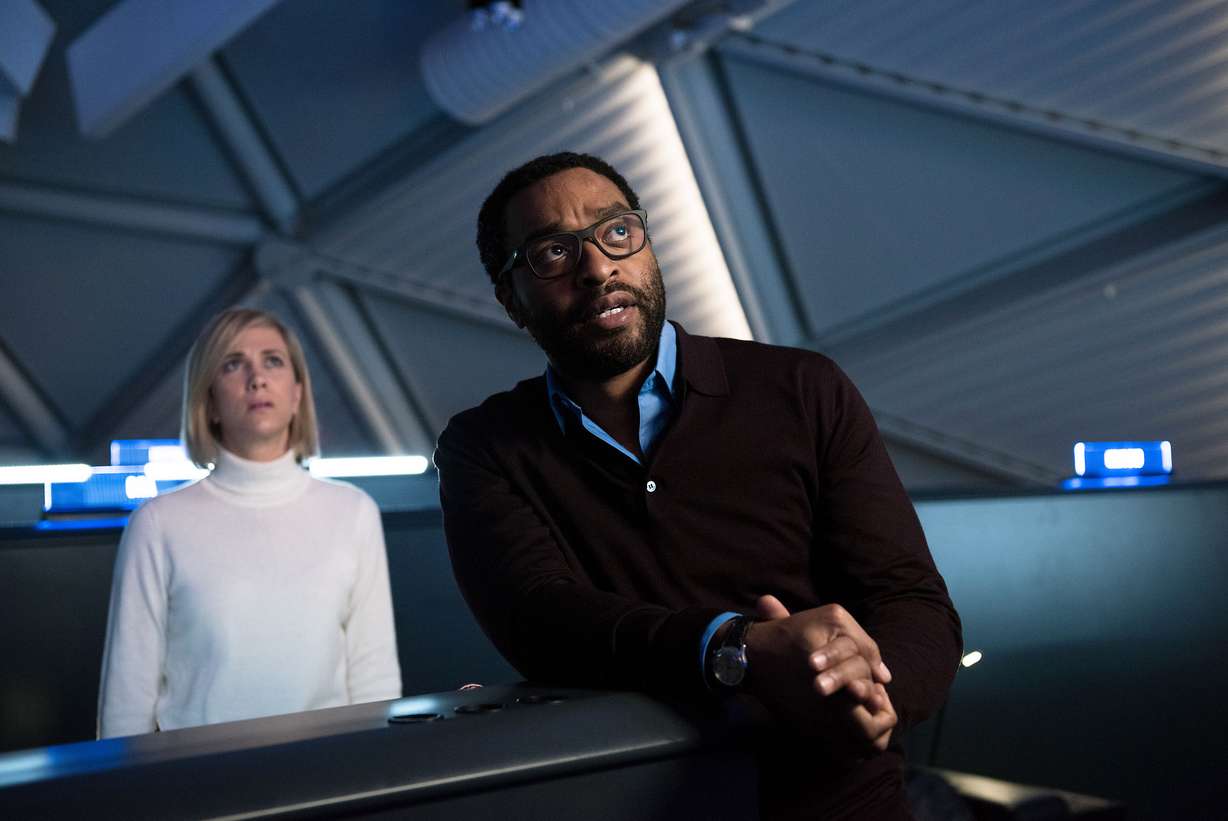 This photo released by 20th Century Fox shows Kristin Wiig, left, and Chiwetel Ejiofor in a scene from the film, "The Martian." (Peter Mountain/20th Century Fox via AP)