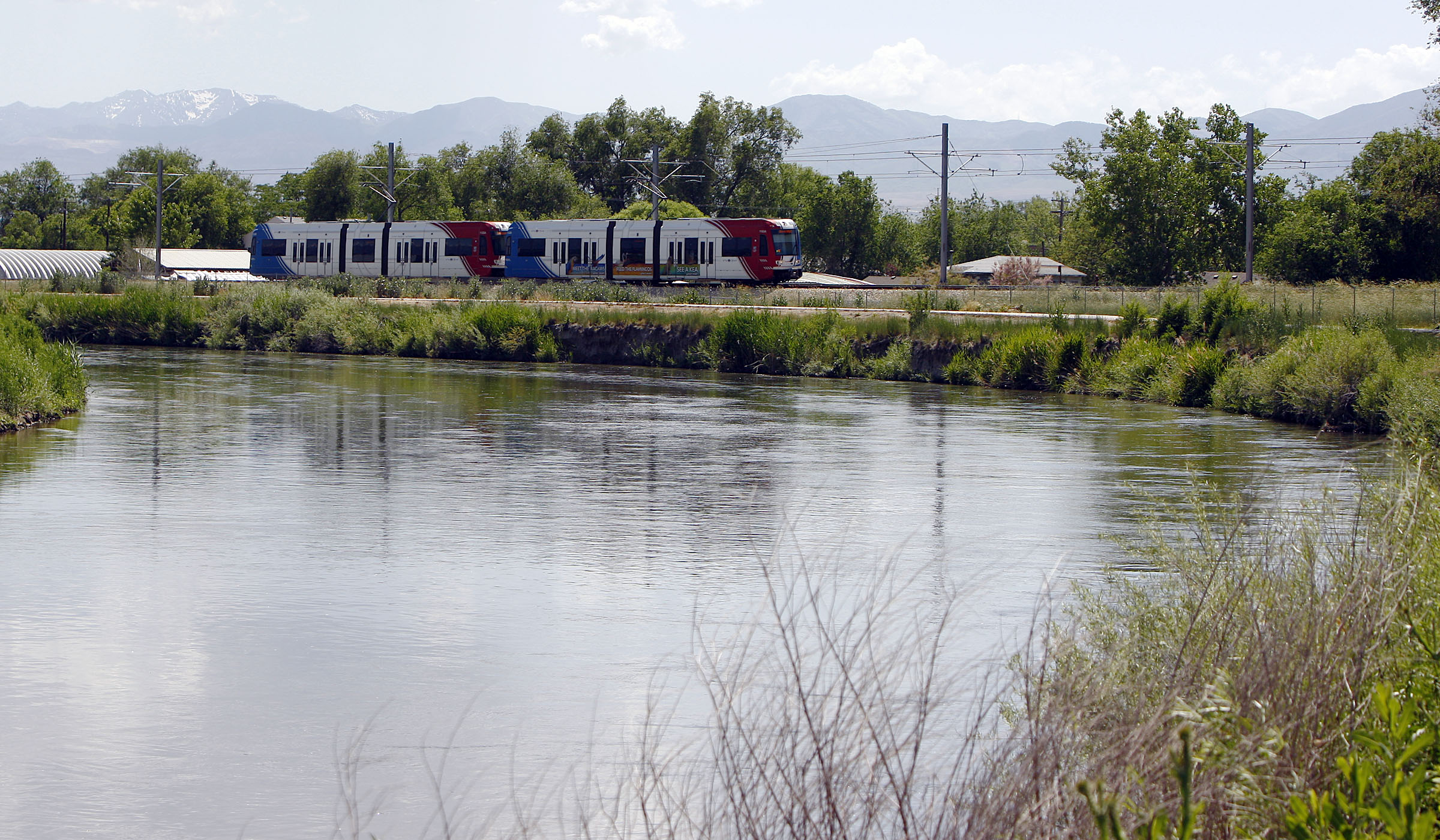 2 businesses charged with dumping concrete mix near Jordan River
