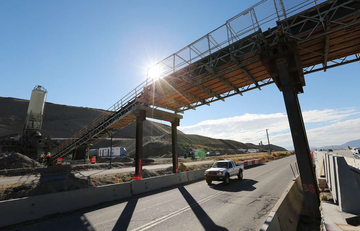 Traffic moves under the UDOT conveyor belt bridge over I-15 near the Point of the Mountain Tuesday, Oct. 6, 2015. The bridge reduces truck trips to and from the work zone, enhances safety for drivers and reduces emissions and fuel consumption during a two-year project to widen I-15 to six lanes in each direction from Lehi to Draper. (Photo: Jeffrey D. Allred, Deseret News)