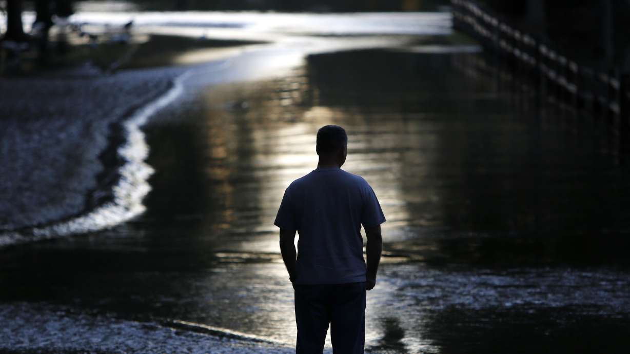 South Carolina still on edge from flooding; 2 people missing
