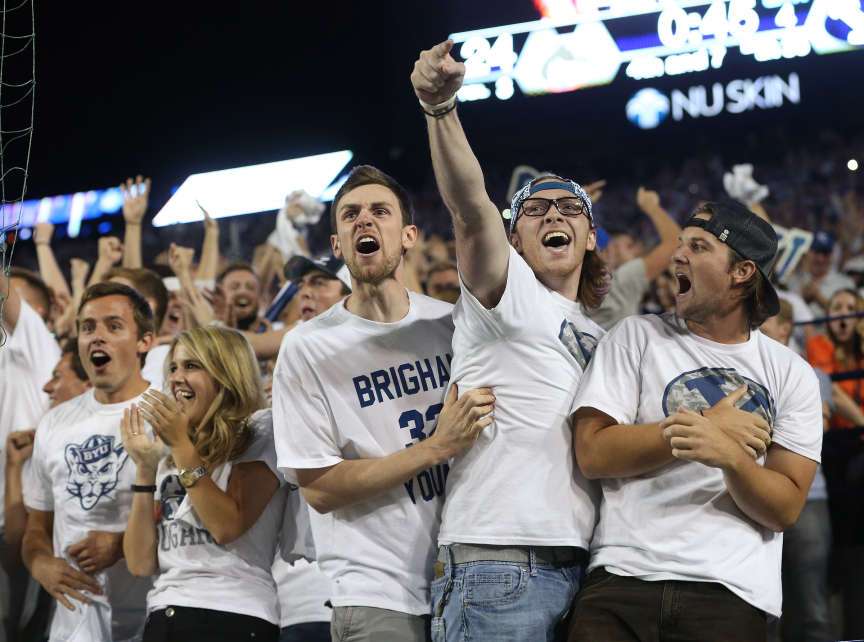 BYU fans cheer after Brigham Young Cougars wide receiver Mitchell Juergens (87) caught the go ahead touchdown as BYU and Boise State play Saturday, Sept. 12, 2015, at LaVell Edwards Stadium in Provo. (Photo: Scott G Winterton, Deseret News)