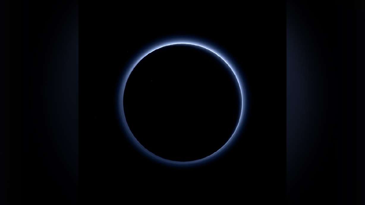 Pluto's blue skies, water ice revealed in new photos