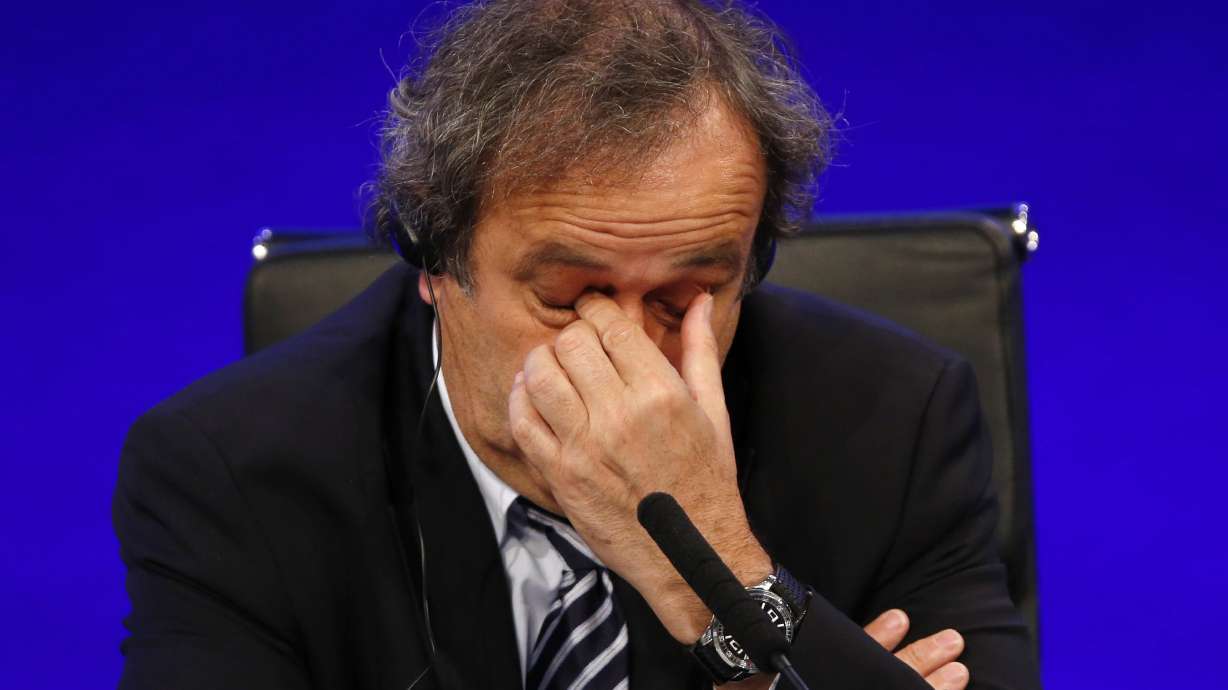 Platini retains UEFA title, with no interim leader in place