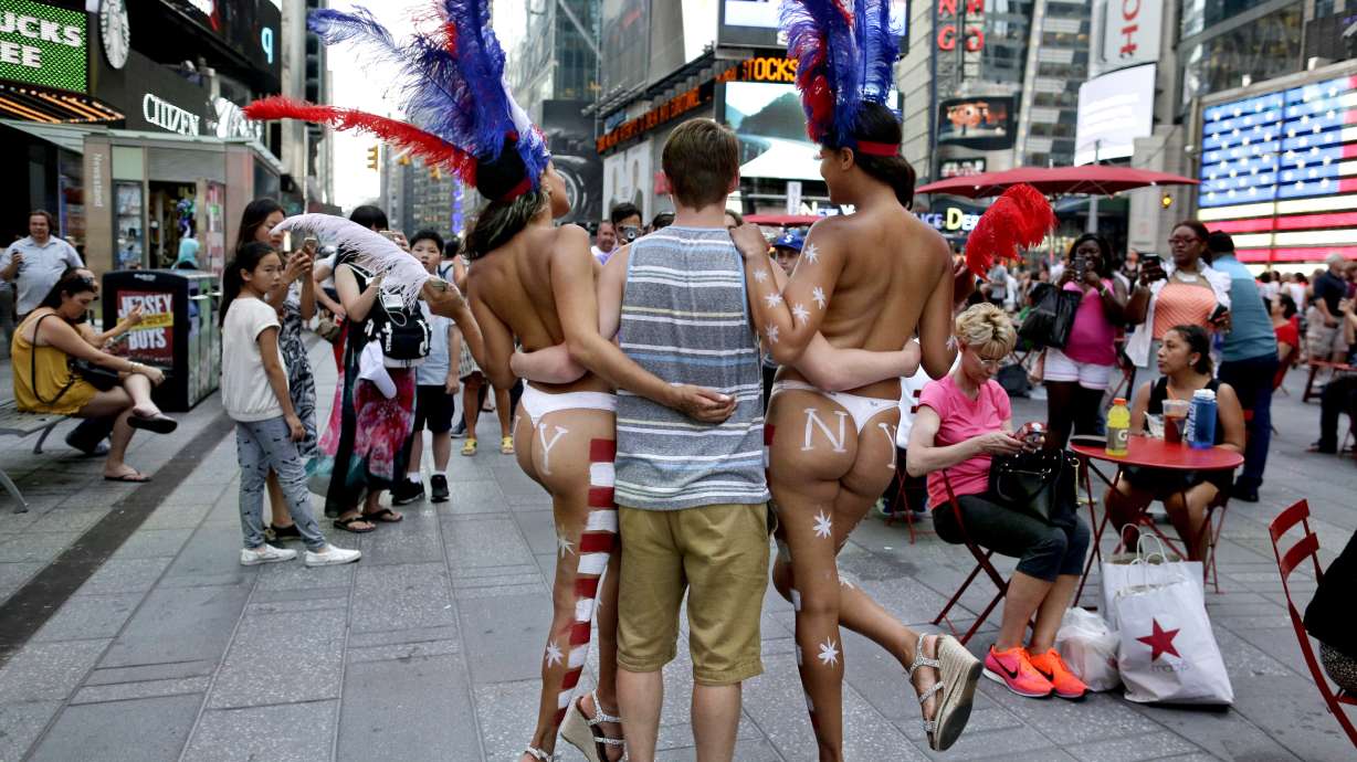 Topless women of Times Square say they can't be restricted