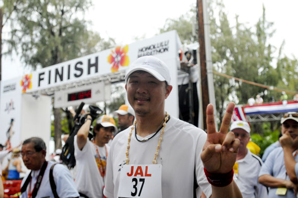 Red Sox pitcher Hideki Okajima gestures after finishing the Honolulu Marathon on Sunday in Honolulu, 2008. (Photo: AP Photo)